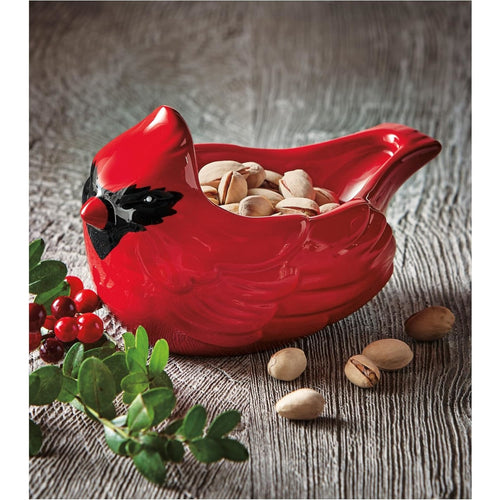 Hand-painted cardinal-shaped bowl holding pistachios, perfect for holiday decor and serving, featured in Home & Decor, Kitchen & Food, and Best Sellers collections.