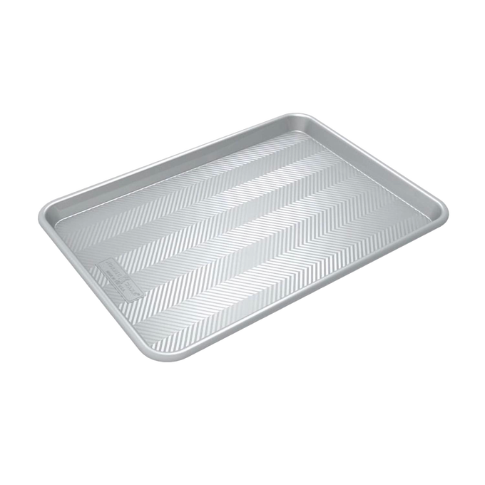 Prism half-sheet aluminum baking pan with a distinctive grid pattern for improved airflow and even browning, featured in Kitchen & Food and USA Made collections.