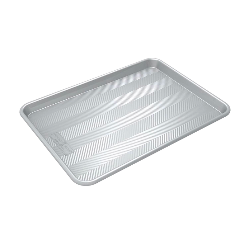 Prism half-sheet aluminum baking pan with a distinctive grid pattern for improved airflow and even browning, featured in Kitchen & Food and USA Made collections.
