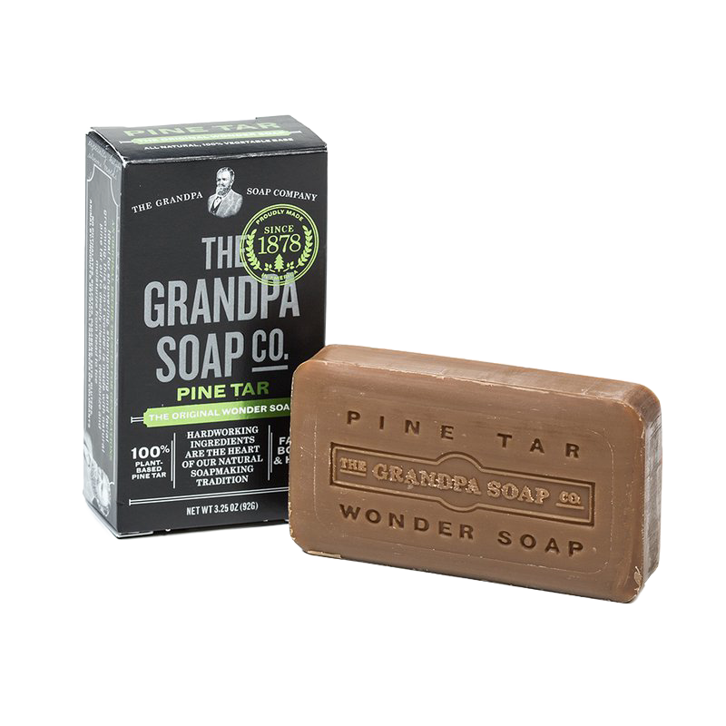 Bar of pine tar soap with embossed branding beside its black and green box, handcrafted and made in USA, featured in Health & Wellness, Grooming and Personal Hygiene, and Best Sellers collections.