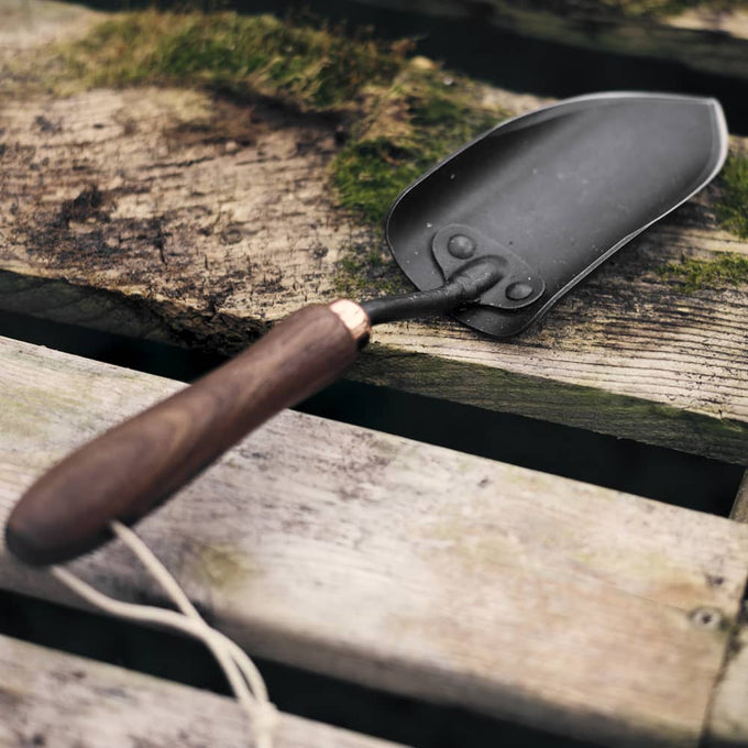 Garden spade hand trowel with rust-resistant heat-treated steel blade and ergonomic walnut handle, crafted for durable digging and cultivating in Farm, Garden & Tool collections.