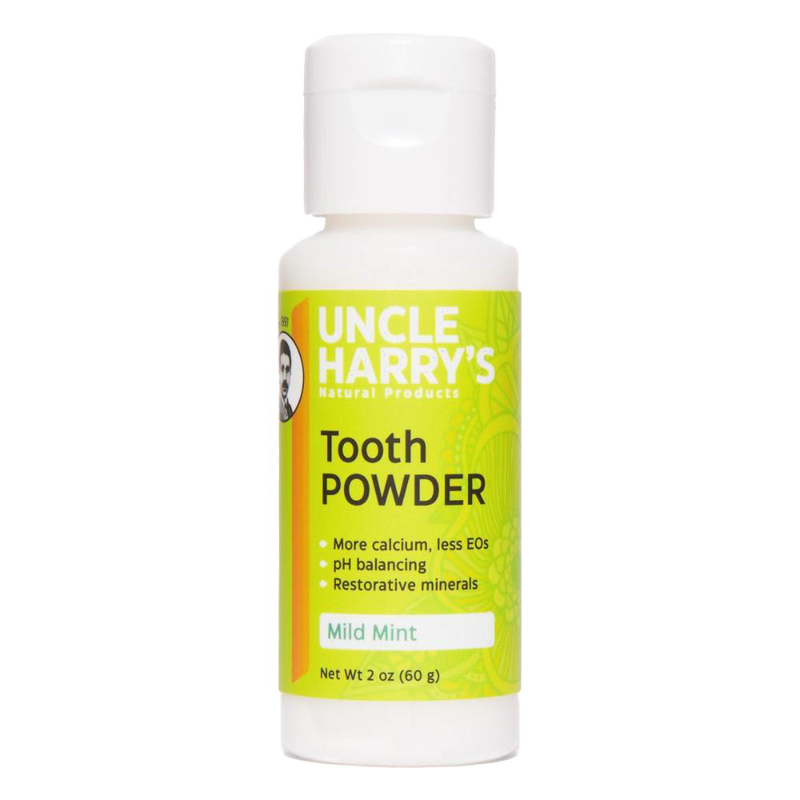 2 oz white plastic bottle of natural tooth powder with bright green label featuring mild mint flavor, pH balancing, restorative minerals, made in USA, ideal for Health & Wellness and Grooming collections.