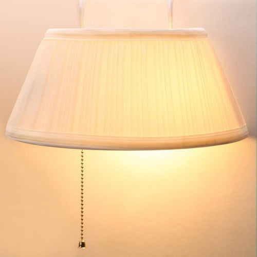 Cream-colored pleated fabric lampshade with pull chain hanging softly, designed for easy bedside lighting in home, camping, and outdoor electric light collections.
