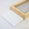 Handcrafted Amish-made white Coroplast debris board sliding into a wooden 5-frame screen base, designed for easy mite monitoring, featured in beekeeping and farm tool collections.
