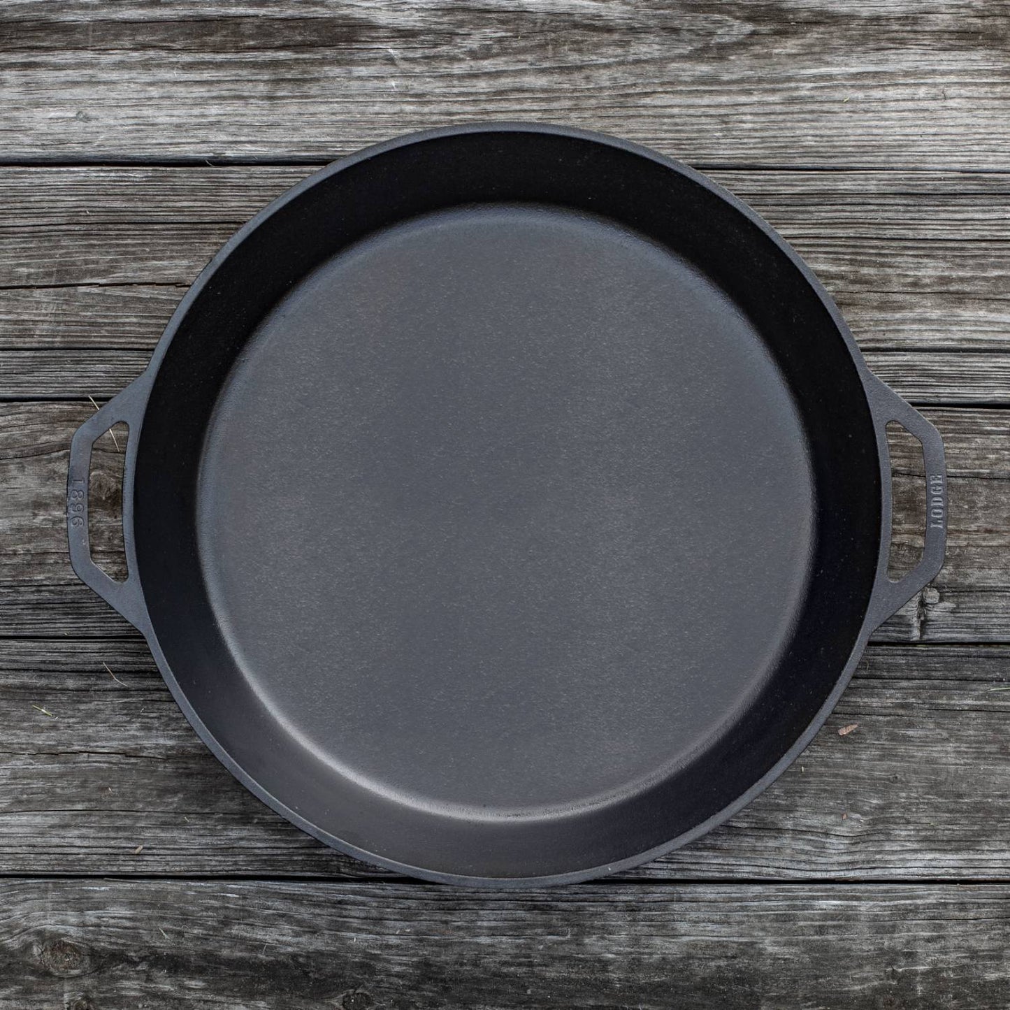 Handcrafted cast iron skillet with two loop handles, designed for large-scale cooking, featured in Kitchen & Food, Cookware, Cast Iron, USA Made, and Best Sellers collections.