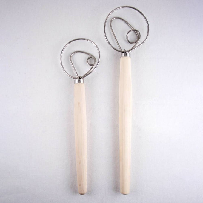 Two sizes of handcrafted dough whisks with wooden handles and spiral metal loops, made in USA, ideal for Kitchen & Food, Baking Supplies, Cookware, Amish Made, and Bread Making collections.