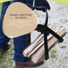 Person wearing gloves holding a sturdy black splitter frame carrying several split logs, designed for easy transport of kindling, featured in Farm, Garden & Tool and Wood Cutting collections.