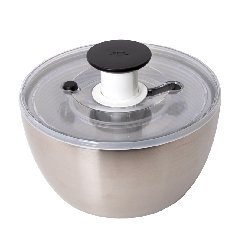Brushed stainless steel salad spinner with clear locking lid and black push-button handle, designed to keep greens crisp and dry for Kitchen & Food, Kitchen Gadgets, and Best Sellers collections.