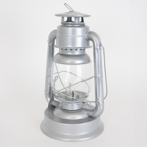 Handcrafted silver metal lantern with clear glass globe and durable baked-on powder-coated finish, designed for reliable use in Farm, Garden & Tool, Camping, Emergency Supplies, and Lamps & Lighting collections.