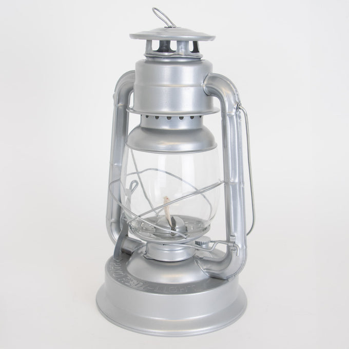 Handcrafted silver metal lantern with clear glass globe and durable baked-on powder-coated finish, designed for reliable use in Farm, Garden & Tool, Camping, Emergency Supplies, and Lamps & Lighting collections.