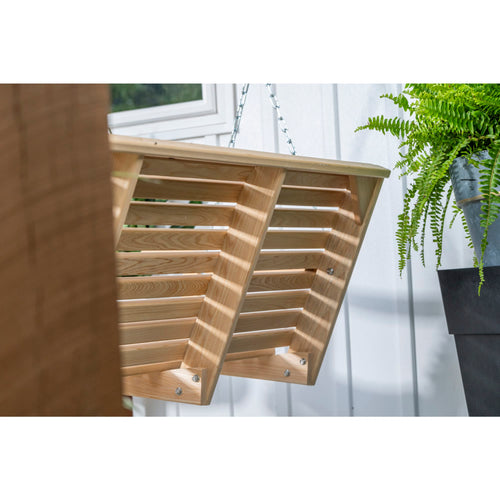 Close-up view of a handcrafted cypress wood hanging porch swing with slatted design, showcasing durable construction and Amish-made quality for home and outdoor furniture collections.