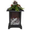 Unique handcrafted LED lantern featuring a cozy faux fireplace with silver logs, topped with faux pine sprigs, red berries, and a pinecone, ideal for Home & Decor, Holiday Decor, and Best Sellers collections.