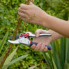 Person using ergonomic ratchet anvil pruners with twist handle to cut a woody stem, designed to reduce hand fatigue, featured in Farm, Garden & Tool, Garden Accessories, Lawncare, and Best Sellers collections.