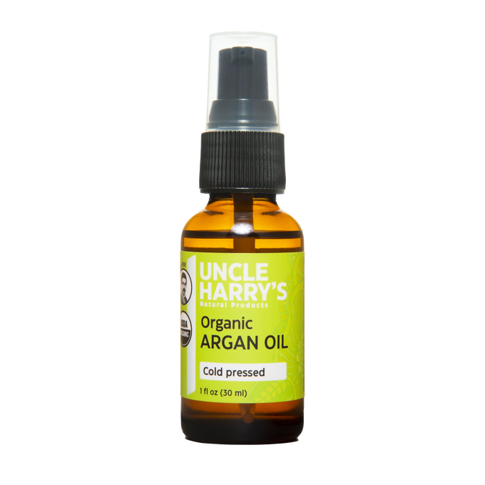 Handcrafted 1oz amber glass bottle of cold-pressed organic argan oil with a black pump, ideal for health and wellness, grooming, and personal hygiene, USA made best seller.