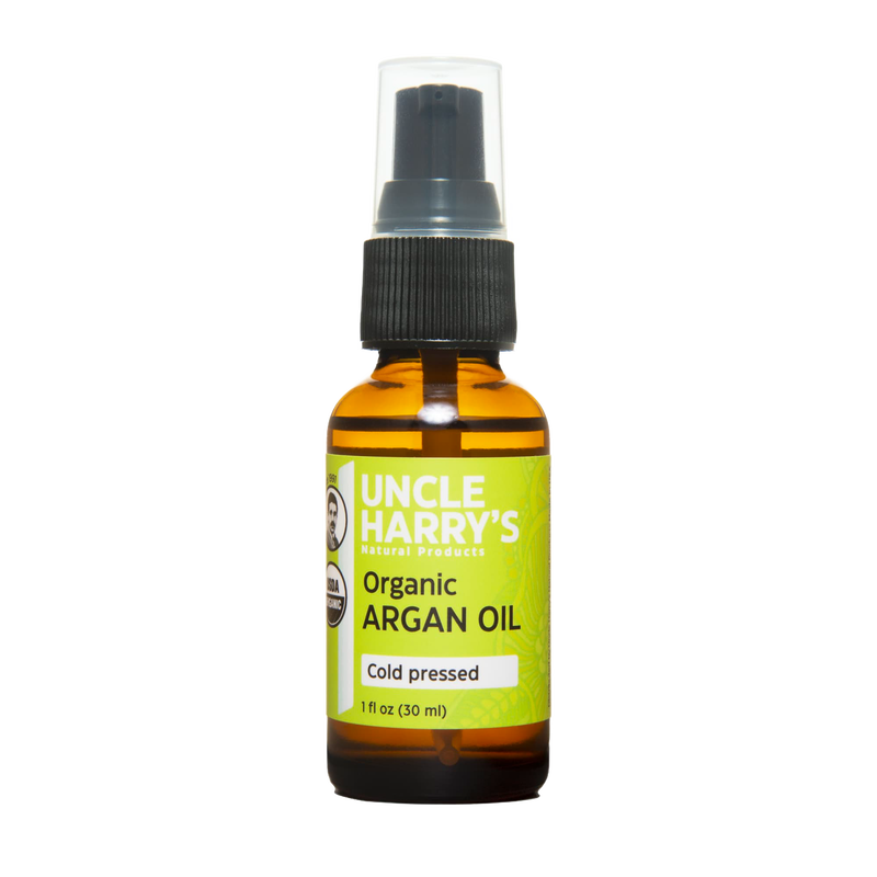 Handcrafted 1oz amber glass bottle of cold-pressed organic argan oil with a black pump, ideal for health and wellness, grooming, and personal hygiene, USA made best seller.