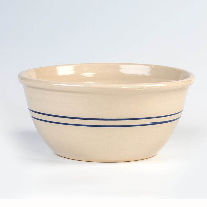 Handmade cream stoneware mixing bowl with two blue stripes, crafted in the USA, suitable for Kitchen & Food, Cookware, Baking Supplies, and Holiday Hosting collections.