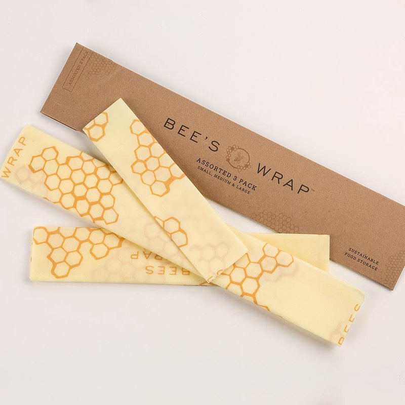 Three-piece set of beeswax-infused muslin wraps with honeycomb pattern, eco-friendly and reusable for food storage, handmade and crafted in the USA, part of Kitchen & Food and Storage and Serving collections.