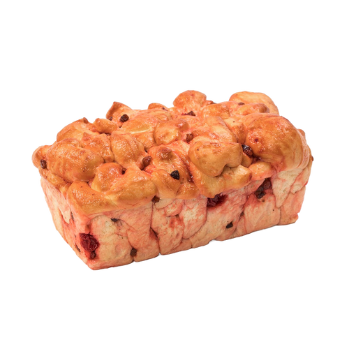 Loaf of handcrafted cherry nut bread with a soft, golden crust and visible cherries and nuts, made in the USA, featured in Kitchen & Food and Snacks and Sweets collections.