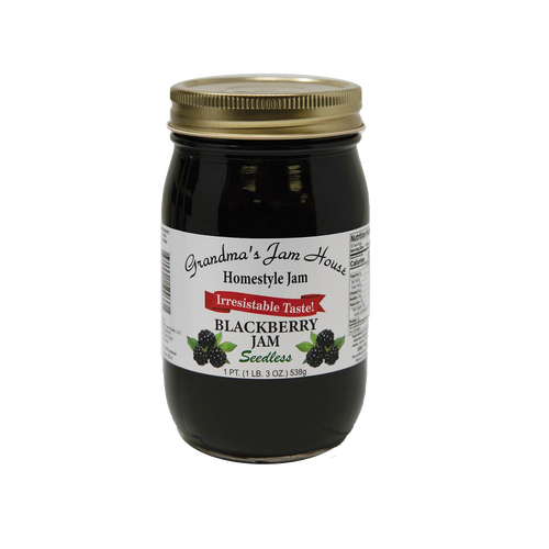 Glass jar of handcrafted seedless blackberry jam with gold lid and white label featuring blackberry illustrations, included in Kitchen & Food, Pantry, Peanut Butter & Jellies, USA Made, Best Sellers, and Promo Eligible collections.