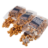 Three clear bags of Lehman's caramel popcorn varieties spilling out flavored popcorn pieces, set against a white background, featured in Kitchen & Food and Snacks and Sweets collections.