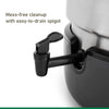 Close-up of an easy-to-drain black spigot on a stainless steel water bath canner, designed for mess-free cleanup in kitchen and food preservation use.