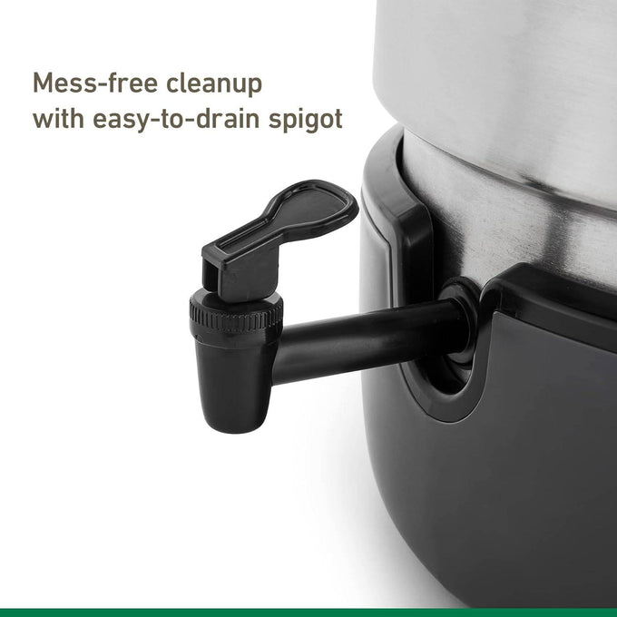 Close-up of an easy-to-drain black spigot on a stainless steel water bath canner, designed for mess-free cleanup in kitchen and food preservation use.