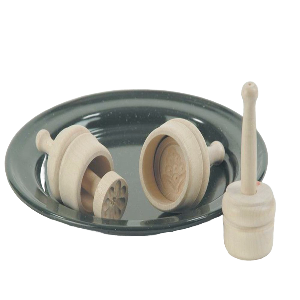 Set of small, finely carved hardwood butter molds with smooth natural finish on a dark dish, ideal for Kitchen & Food, Specialty Equipment, Making Butter, Best Sellers, and Promo Eligible collections.