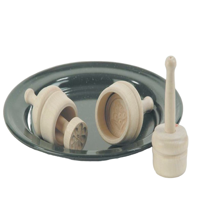 Set of small, finely carved hardwood butter molds with smooth natural finish on a dark dish, ideal for Kitchen & Food, Specialty Equipment, Making Butter, Best Sellers, and Promo Eligible collections.