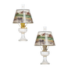 Pair of clear glass oil lamps featuring brass burners and Rocky Mountain scenic parchment shades, ideal for Lamps & Lighting, Oil Lamps, Table Lamps, Best Sellers, and Promo Eligible collections.