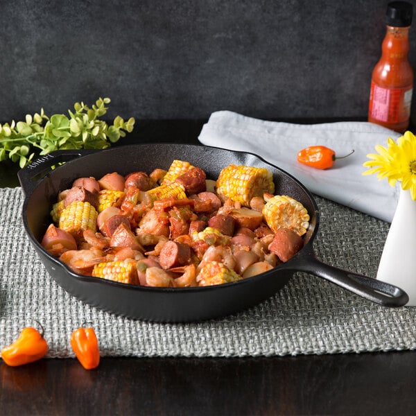 Handcrafted Lodge Classic Cast Iron Skillet filled with cooked sausage, vegetables, and corn on the cob, showcasing exceptional heat retention for Kitchen & Food, Cookware, Cast Iron, Best Sellers, Promo Eligible collections.