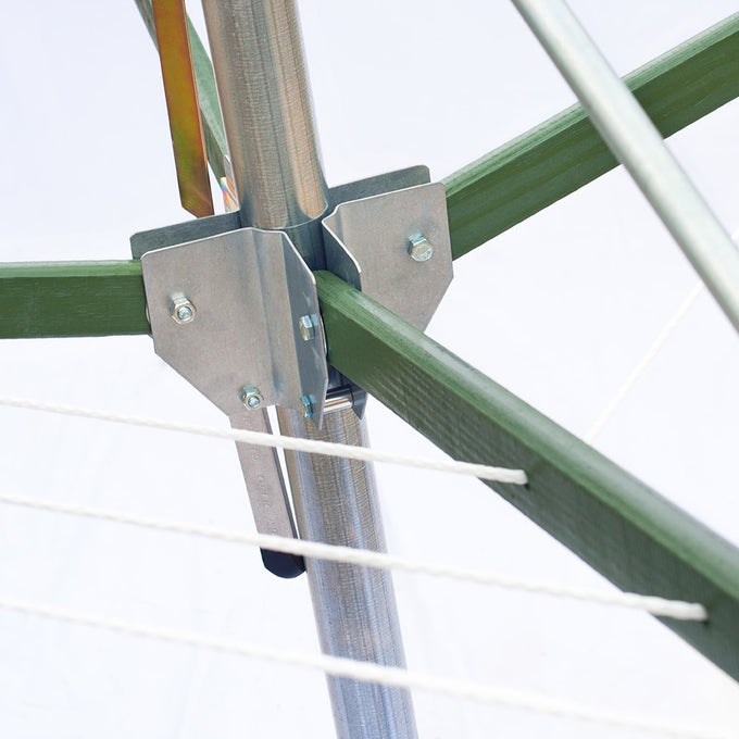 Close-up of sturdy metal brackets securing green wooden arms to a central metal pole of a handcrafted rotating clothes dryer, featuring durable natural fiber clotheslines for Home & Decor and Laundry Supplies collections.