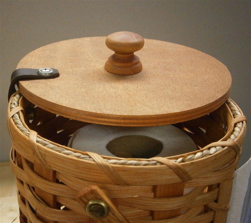 Handcrafted Amish-made paper towel holder featuring woven basket sides, smooth wooden lid with knob, designed for neat storage and easy access in Home & Decor and Household Helpers collections.
