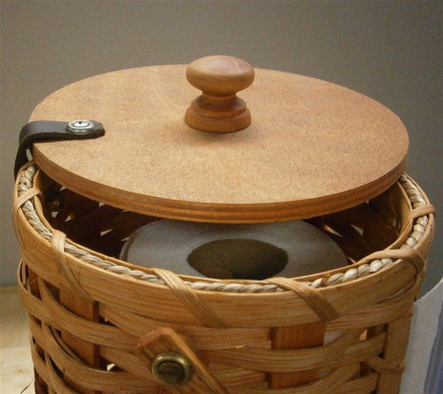 Handcrafted Amish-made paper towel holder featuring woven basket sides, smooth wooden lid with knob, designed for neat storage and easy access in Home & Decor and Household Helpers collections.