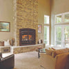 Living room featuring a Hearthstone wood fireplace with stacked ledgestone surround, warm fire glowing inside, surrounded by large windows and comfortable seating in a cozy setting, part of Stoves, Heatstoves, Best Sellers, and Hearthstone Wood Heatstoves collections.