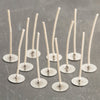 Set of pre-waxed paper wick tabs with metal bases, handcrafted in the USA for use in votive and small container candles, featured in Candlemaking Supplies and Lamps & Lighting collections.