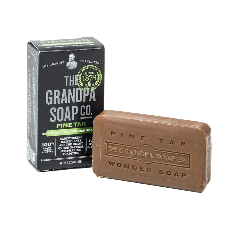 Rustic handcrafted pine tar soap bar with embossed branding, made in USA, ideal for Grooming and Personal Hygiene, Health & Wellness, and Soaps collections.