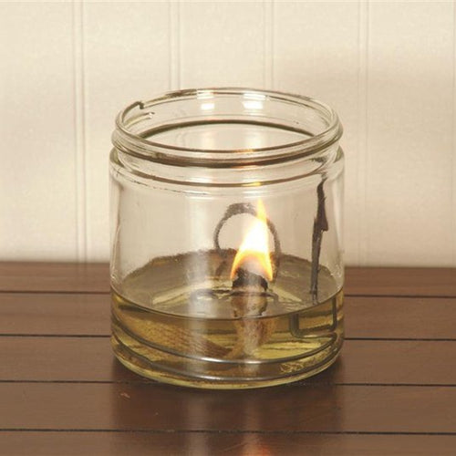 Handcrafted wide flat-wick olive oil lamp burning with a bright flame in a clear glass jar, perfect for Lamps & Lighting, USA Made, Oil Lamps, and Best Sellers collections.