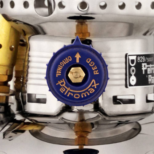 Close-up of the blue control valve on a polished metal kerosene pressure lamp, crafted for durable use in camping, emergency supplies, and outdoor lighting collections.