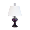 Handcrafted amethyst glass oil lamp with a vintage-inspired design, topped with a white pleated cloth shade and tripod base, featured in Lamps & Lighting and Best Sellers collections.
