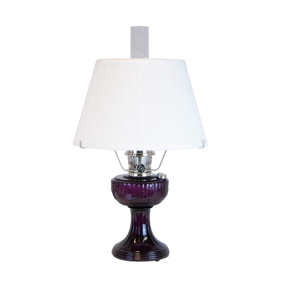 Handcrafted amethyst glass oil lamp with a vintage-inspired design, topped with a white pleated cloth shade and tripod base, featured in Lamps & Lighting and Best Sellers collections.