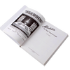 Open hardcover book titled "Aladdin: The Magic Name in Lamps" featuring black and white historic photos and illustrations, ideal for Toys, Books & Games and Heritage and Lifestyle Books collections.