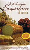 Cover of wholesome sugar-free cooking book featuring sliced bread, honey-glazed toast, fresh orange, grapes, wheat grains, and dried flowers, ideal for health and wellness book collections.