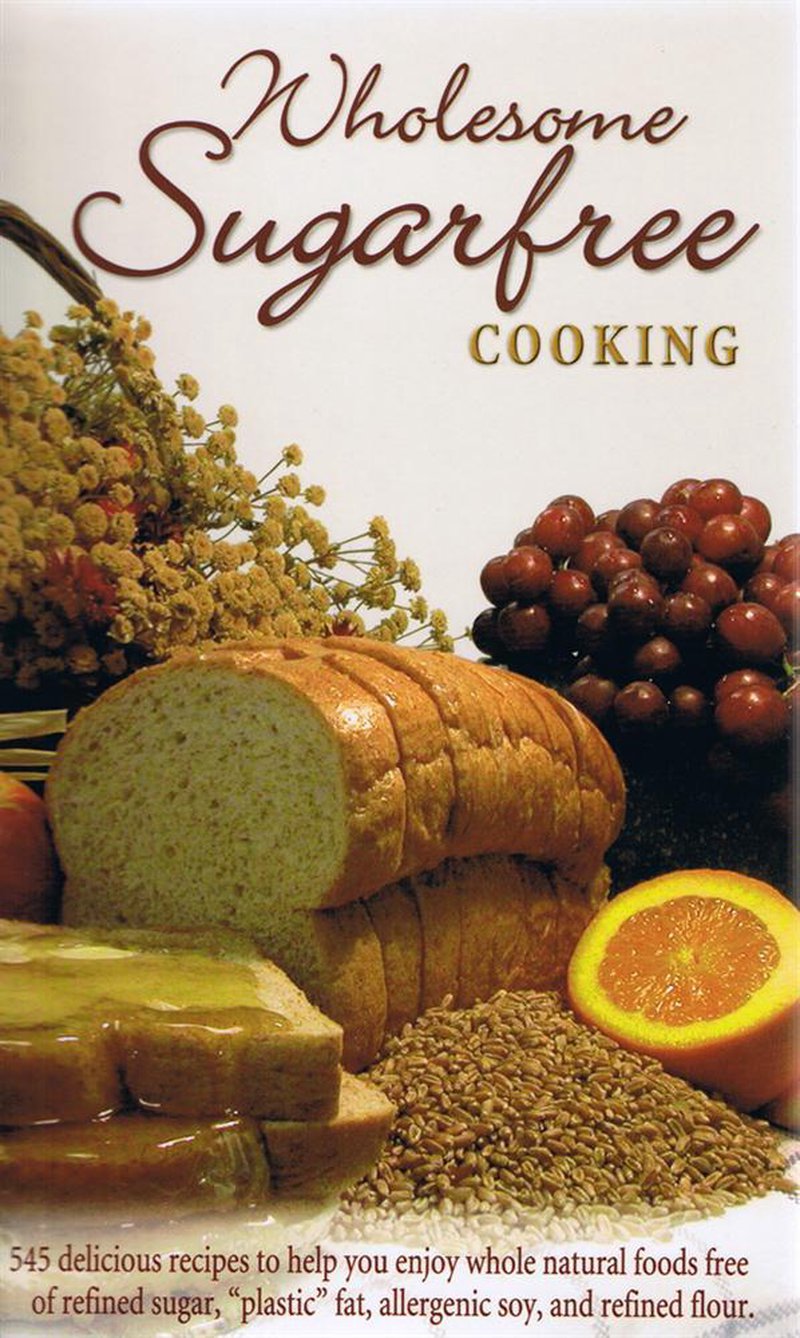 Cover of wholesome sugar-free cooking book featuring sliced bread, honey-glazed toast, fresh orange, grapes, wheat grains, and dried flowers, ideal for health and wellness book collections.