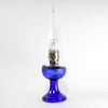 Handcrafted cobalt glass oil lamp with sweeping font design, brass burner, and tall clear chimney, ideal for Lamps & Lighting, Oil Lamps, Table Lamps, Best Sellers, and Promo Eligible collections.