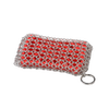 Handcrafted chainmail scrubbing pad with durable stainless steel rings over a red scrubber, designed for safe and effective cleaning of cookware in Kitchen & Food and Household Cleaning collections.