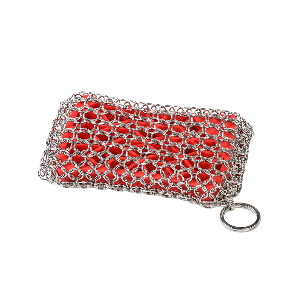 Handcrafted chainmail scrubbing pad with durable stainless steel rings over a red scrubber, designed for safe and effective cleaning of cookware in Kitchen & Food and Household Cleaning collections.