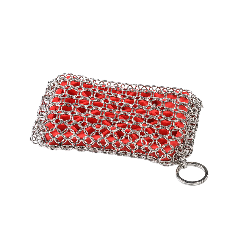 Handcrafted chainmail scrubbing pad with durable stainless steel rings over a red scrubber, designed for safe and effective cleaning of cookware in Kitchen & Food and Household Cleaning collections.