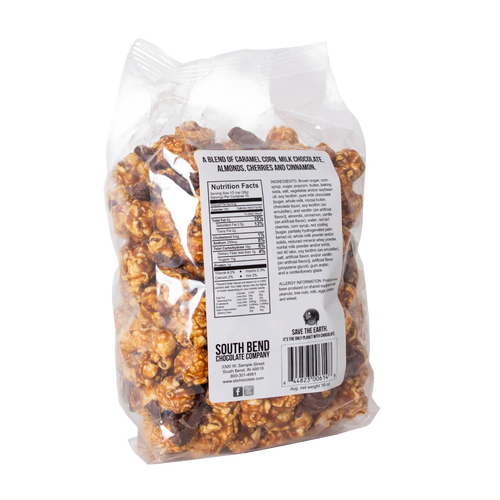 Clear bag of handcrafted caramel popcorn mixed with almonds, cherries, cinnamon, and chocolate pieces, labeled with nutrition facts, featured in Kitchen & Food, Snacks and Sweets, Popcorn, Best Sellers, and Promo Eligible collections.