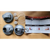 Set of three wide-mouth fermentation lids in gray with flexible silicone gaskets and airlock plugs, arranged alongside a printed recipe guide, ideal for Kitchen & Food and Food Preservation collections.