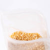 Bag of natural beeswax pellets in a resealable pouch, ideal for crafting pure beeswax candles, featured in candlemaking supplies and lamps and lighting collections.